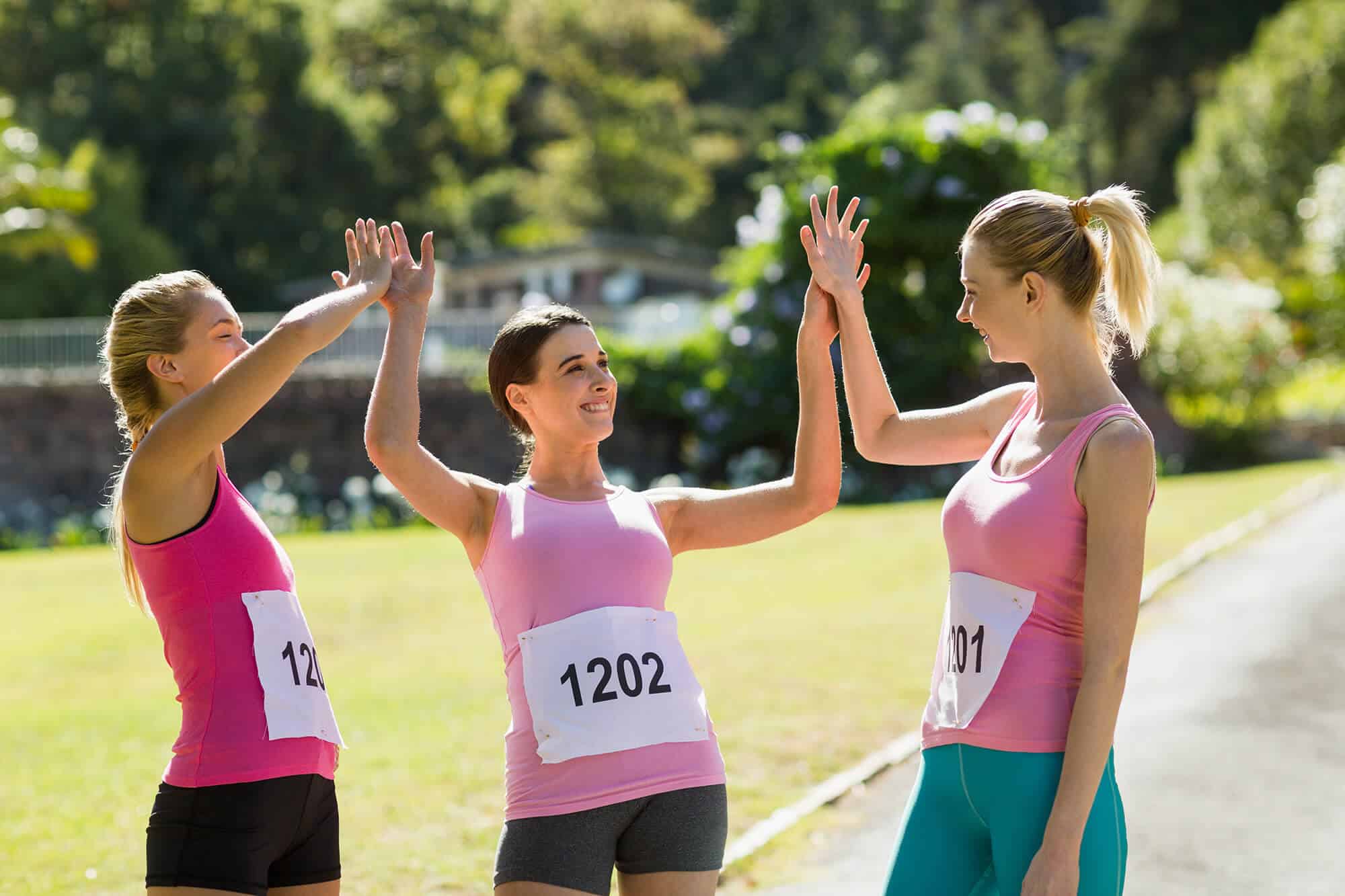 female-athletes-giving-high-five-to-each-other-2023-11-27-04-56-40-utc